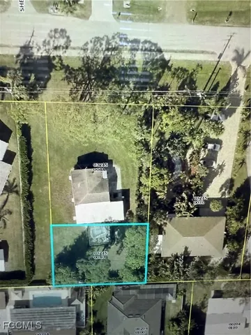 a aerial view of a house with a yard