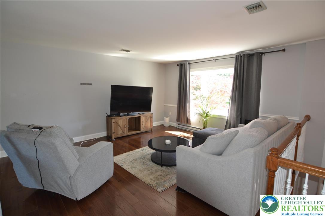 3071 Athena Drive Bethlehem, PA 18017 - Photo 11 of 27 a living room with furniture and a flat screen tv