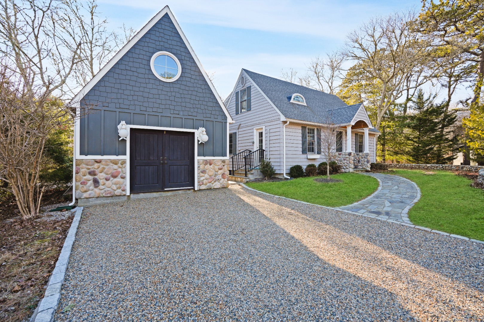 26 Sea Glen Road Oak Bluffs, MA 02557 - Photo 2 of 36 a front view of a house with a yard and garage