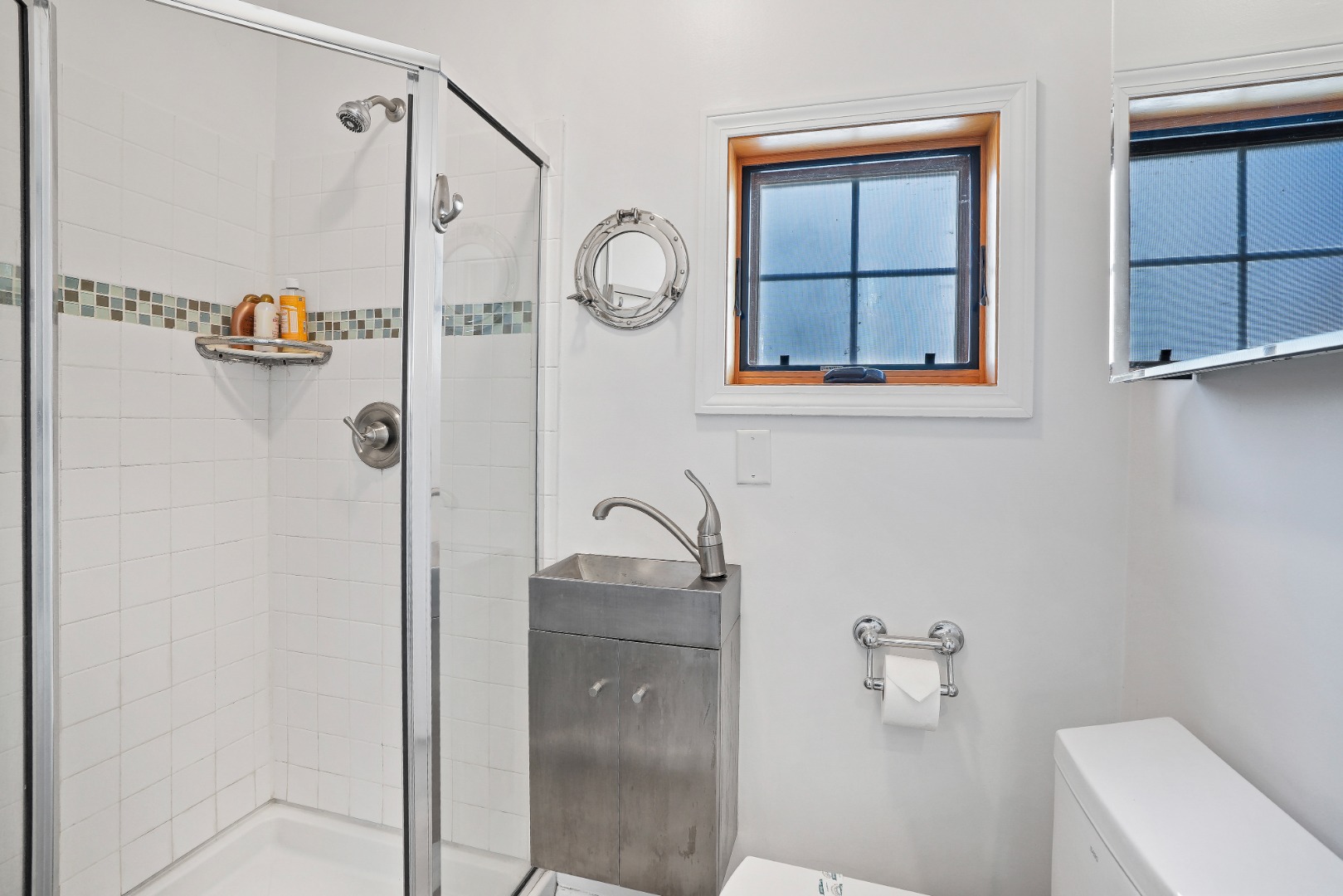 26 Sea Glen Road Oak Bluffs, MA 02557 - Photo 28 of 36 a bathroom with a granite countertop shower a sink and a toilet