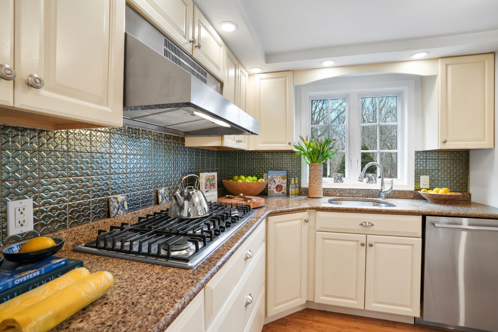 26 Sea Glen Road Oak Bluffs, MA 02557 - Photo 10 of 36 a kitchen with stove a sink and cabinets