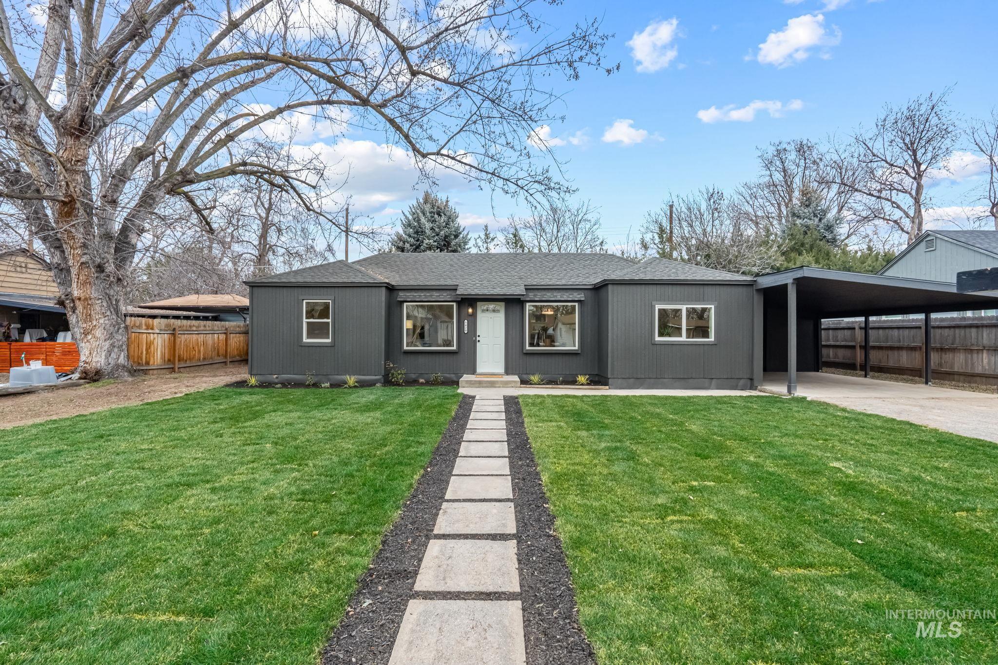 5420 Anna Street Boise, ID 83705 - Photo 1 of 24 Ranch-style house featuring roof with shingles, an attached carport, and driveway