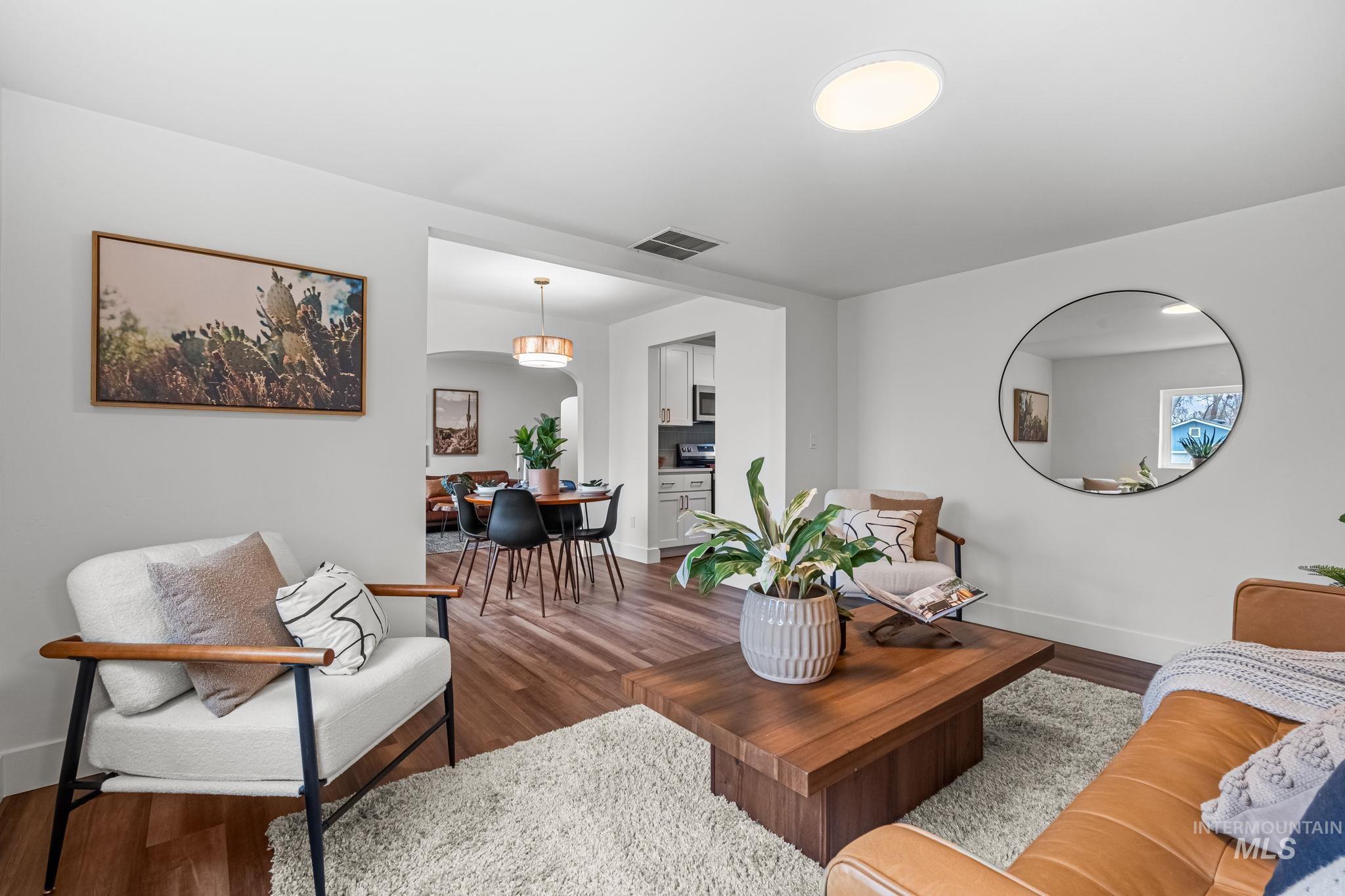 5420 Anna Street Boise, ID 83705 - Photo 11 of 24 Living room featuring baseboards and dark wood finished floors