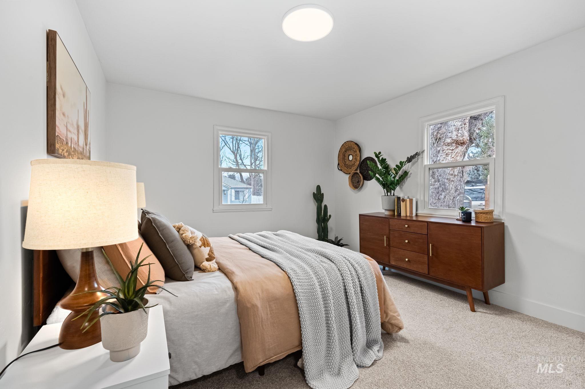5420 Anna Street Boise, ID 83705 - Photo 18 of 24 Bedroom featuring multiple windows and light colored carpet
