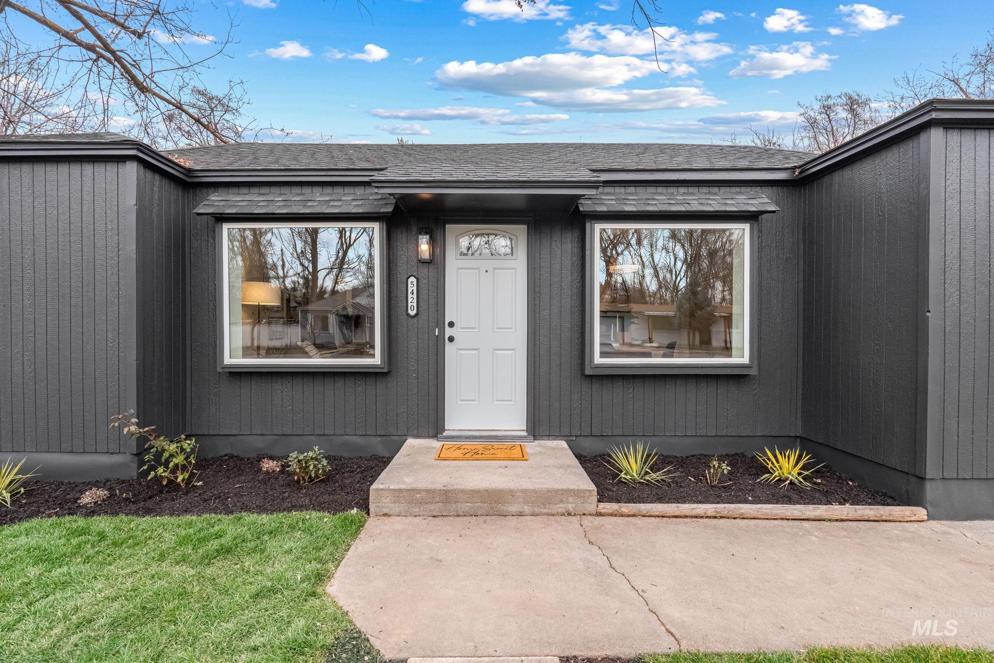 5420 Anna Street Boise, ID 83705 - Photo 4 of 24 Property entrance featuring a shingled roof and a yard