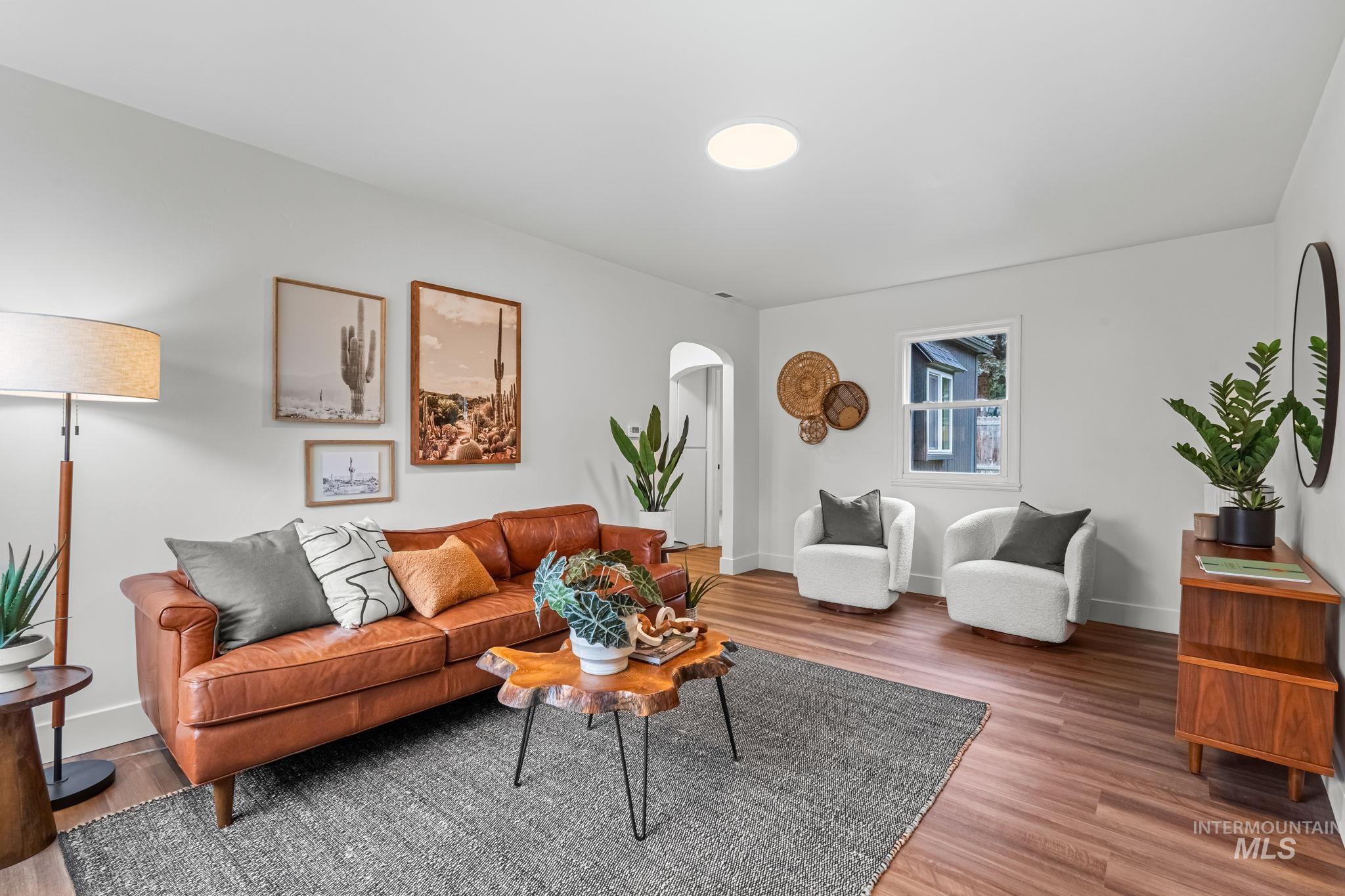 5420 Anna Street Boise, ID 83705 - Photo 5 of 24 Living area featuring light wood-style flooring and arched walkways