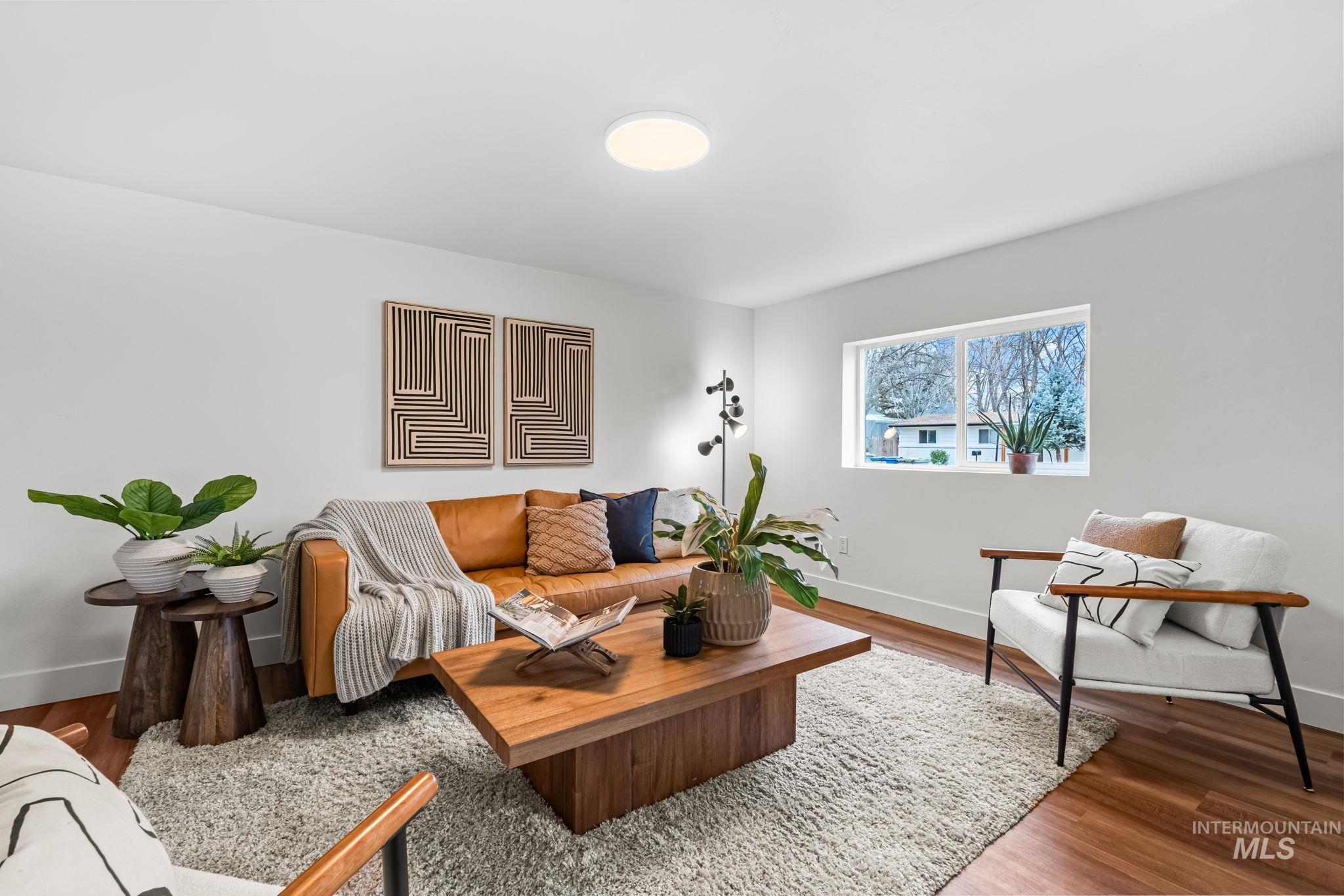 5420 Anna Street Boise, ID 83705 - Photo 10 of 24 Living area with baseboards and wood finished floors