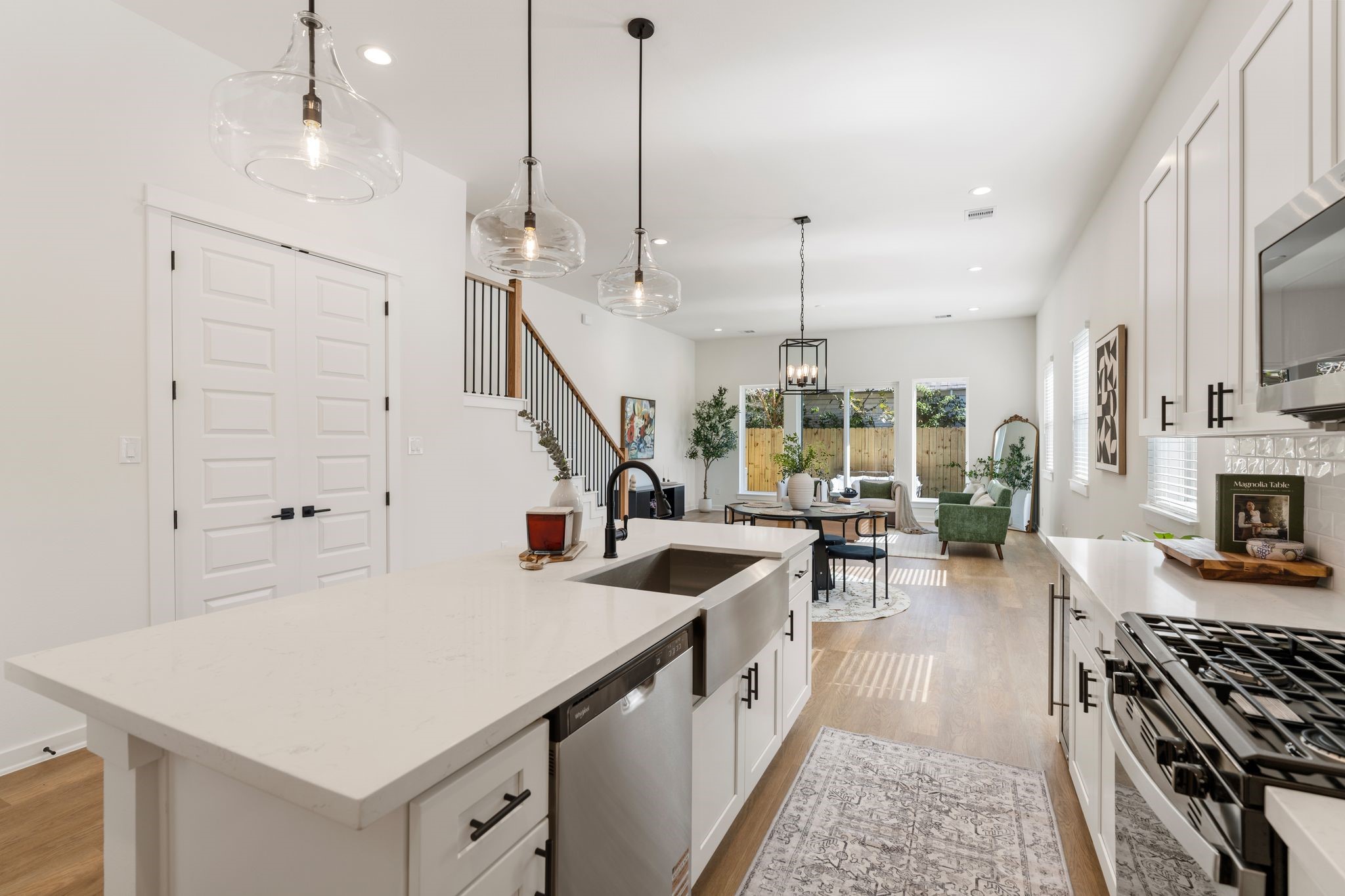 1215 Sampson Street Houston, TX 77003 - Photo 8 of 35 The kitchen flows seamlessly into the dining and living areas.