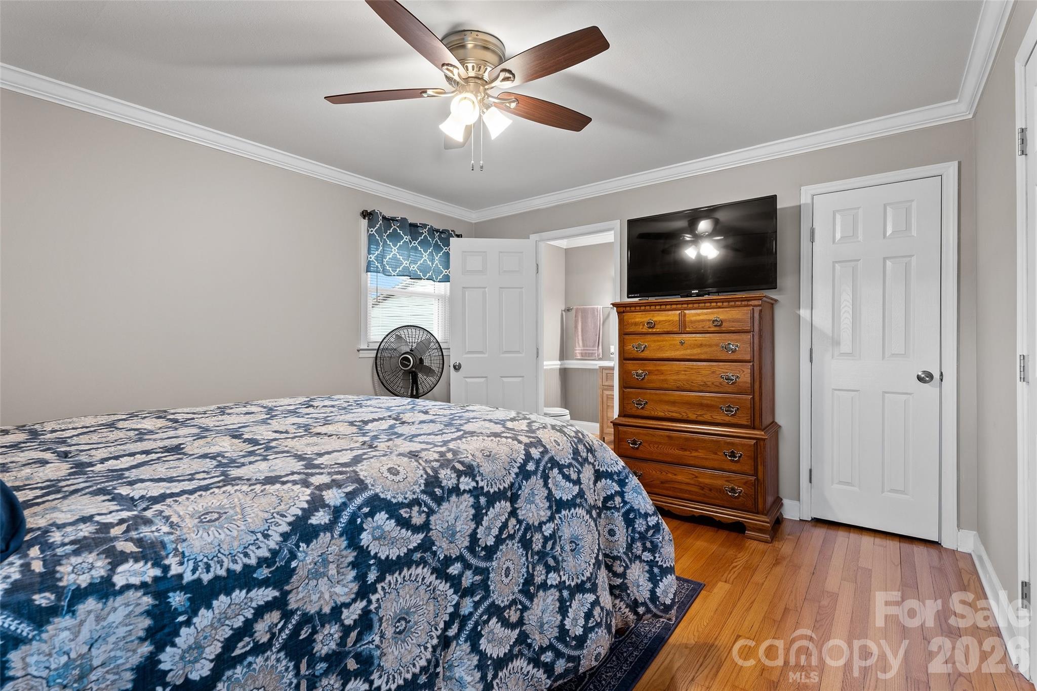871 Saluda Road Chester, SC 29706 - Photo 20 of 46 a bedroom with a bed and a chandelier