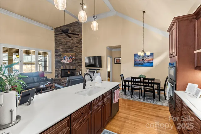 a kitchen with counter top space appliances and furniture