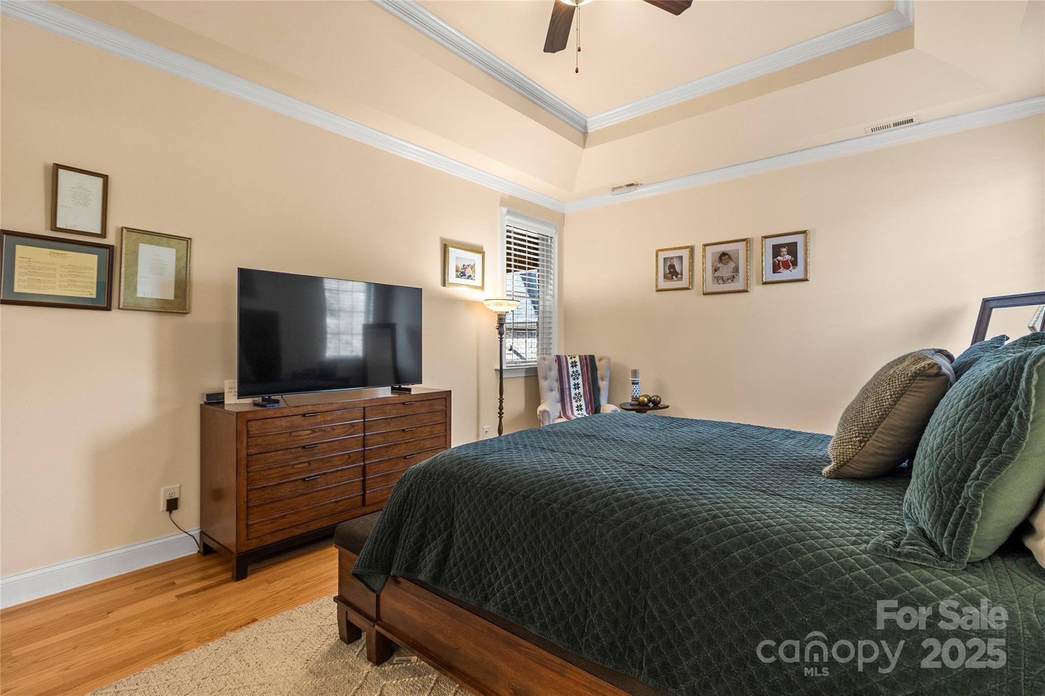 6197 Gold Springs Way Denver, NC 28037 - Photo 19 of 47 a bedroom with a bed and a flat screen tv
