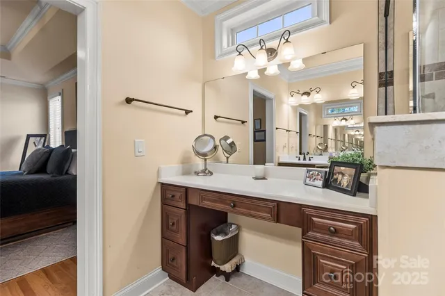 a bathroom with a sink vanity and a mirror