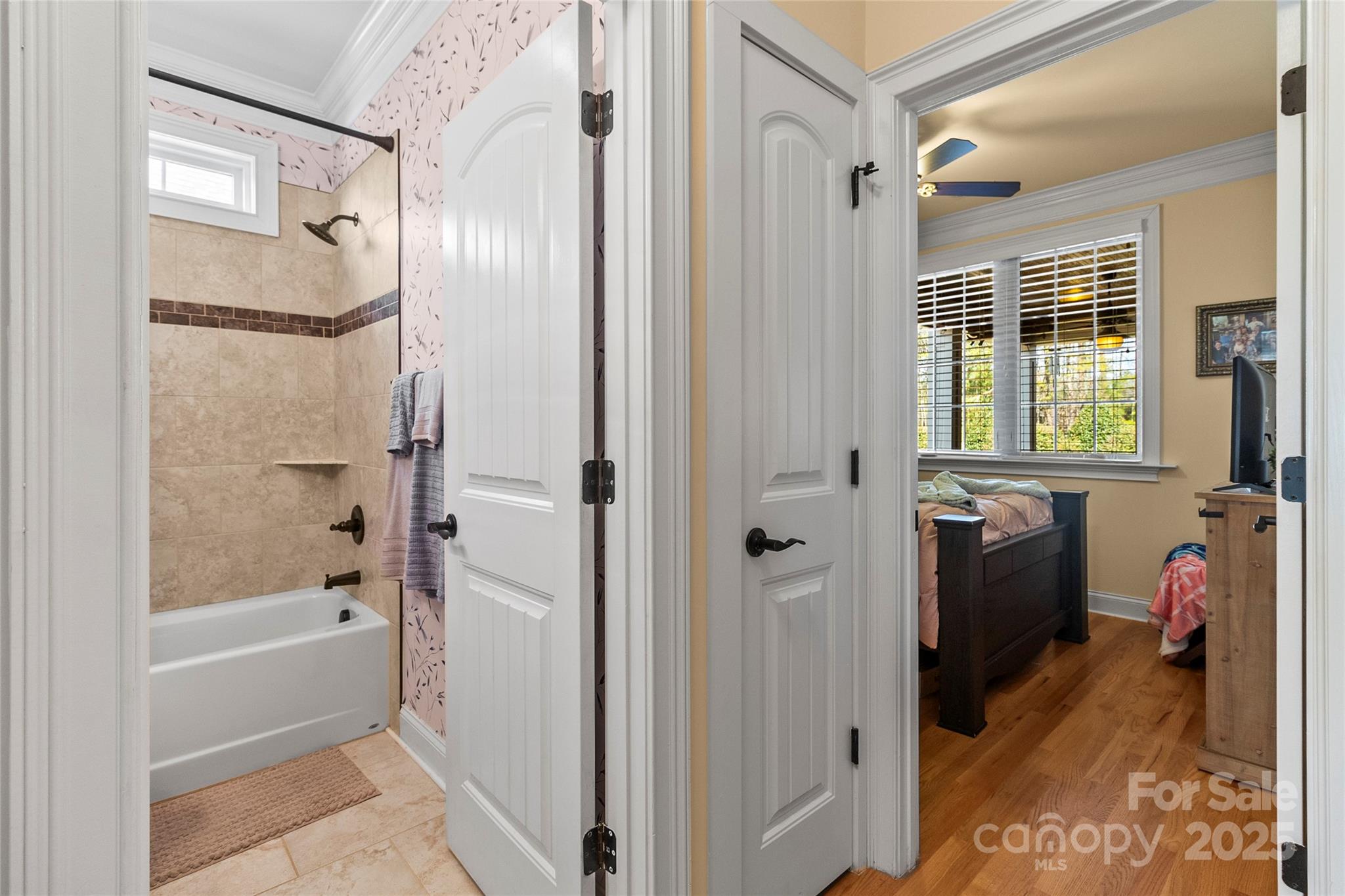 6197 Gold Springs Way Denver, NC 28037 - Photo 25 of 47 a bathroom with a tub shower and a sink