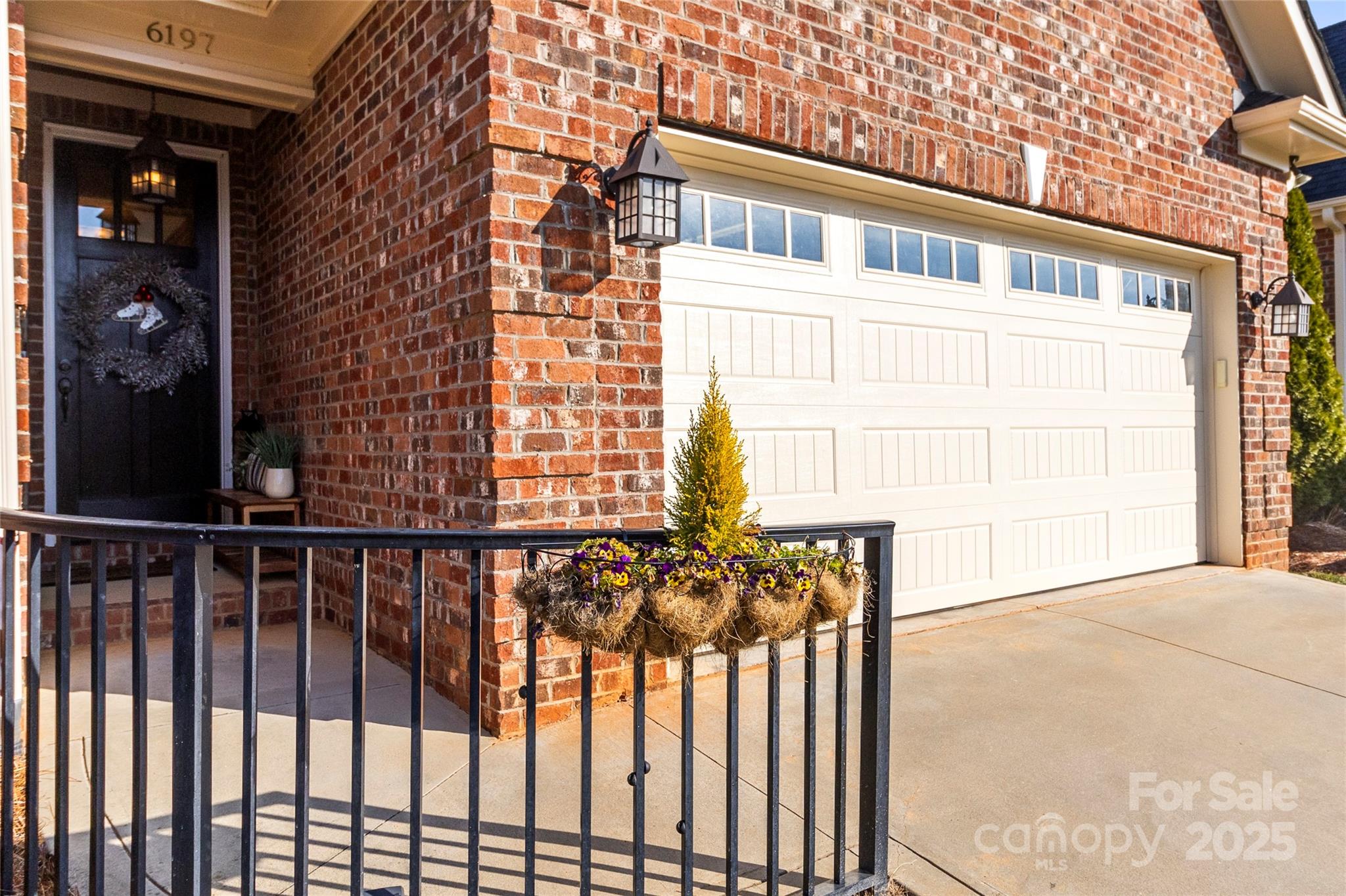 6197 Gold Springs Way Denver, NC 28037 - Photo 4 of 47 a view of a brick house with a small yard