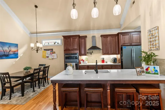 a kitchen with a table and chairs in it
