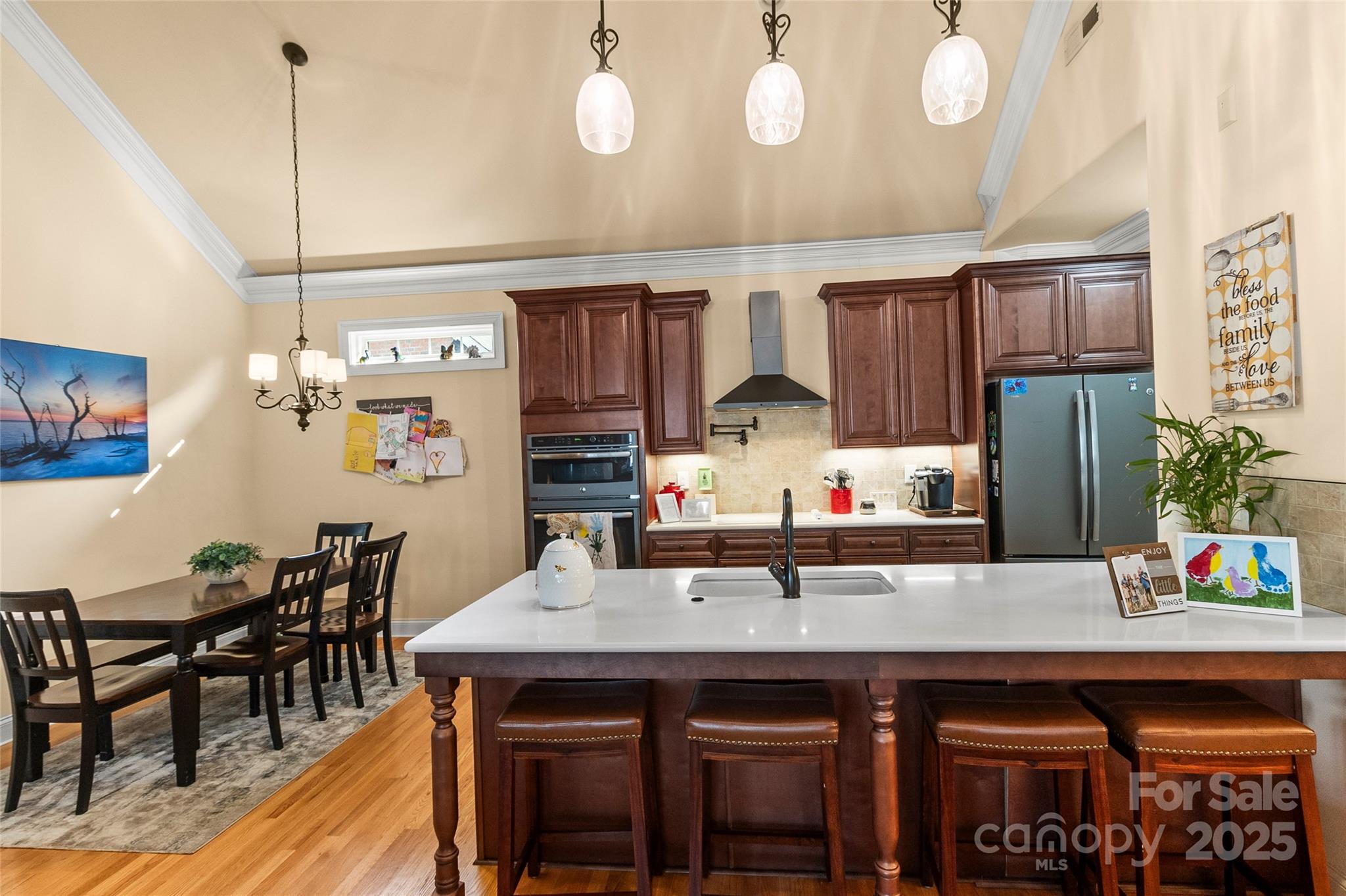 6197 Gold Springs Way Denver, NC 28037 - Photo 6 of 47 a kitchen with a table and chairs in it