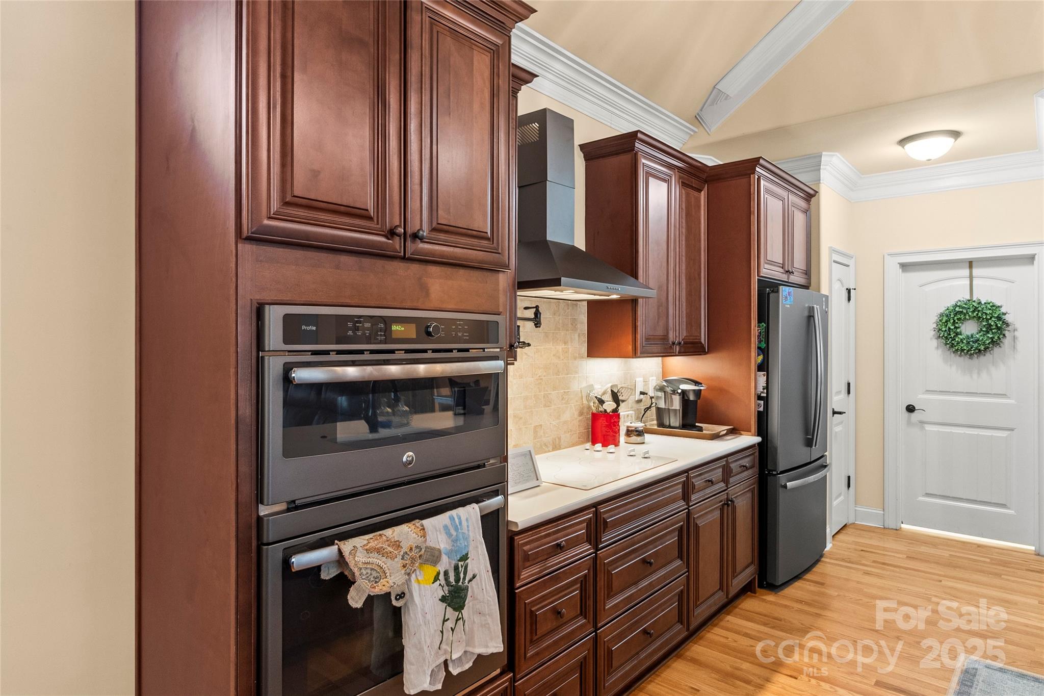 6197 Gold Springs Way Denver, NC 28037 - Photo 7 of 47 a kitchen with stainless steel appliances granite countertop a stove sink and cabinets