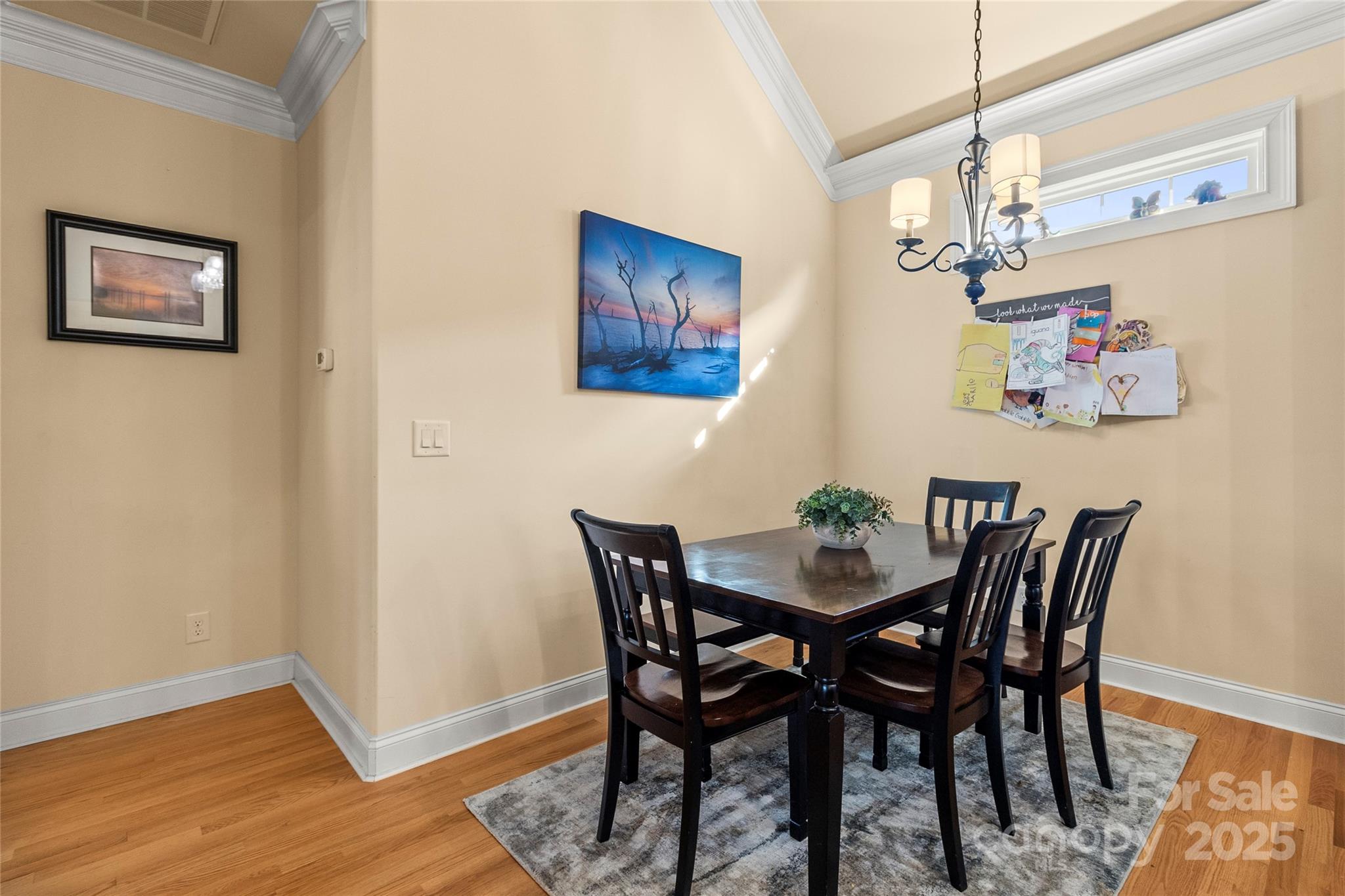 6197 Gold Springs Way Denver, NC 28037 - Photo 10 of 47 a view of a dining room with furniture and wooden floor