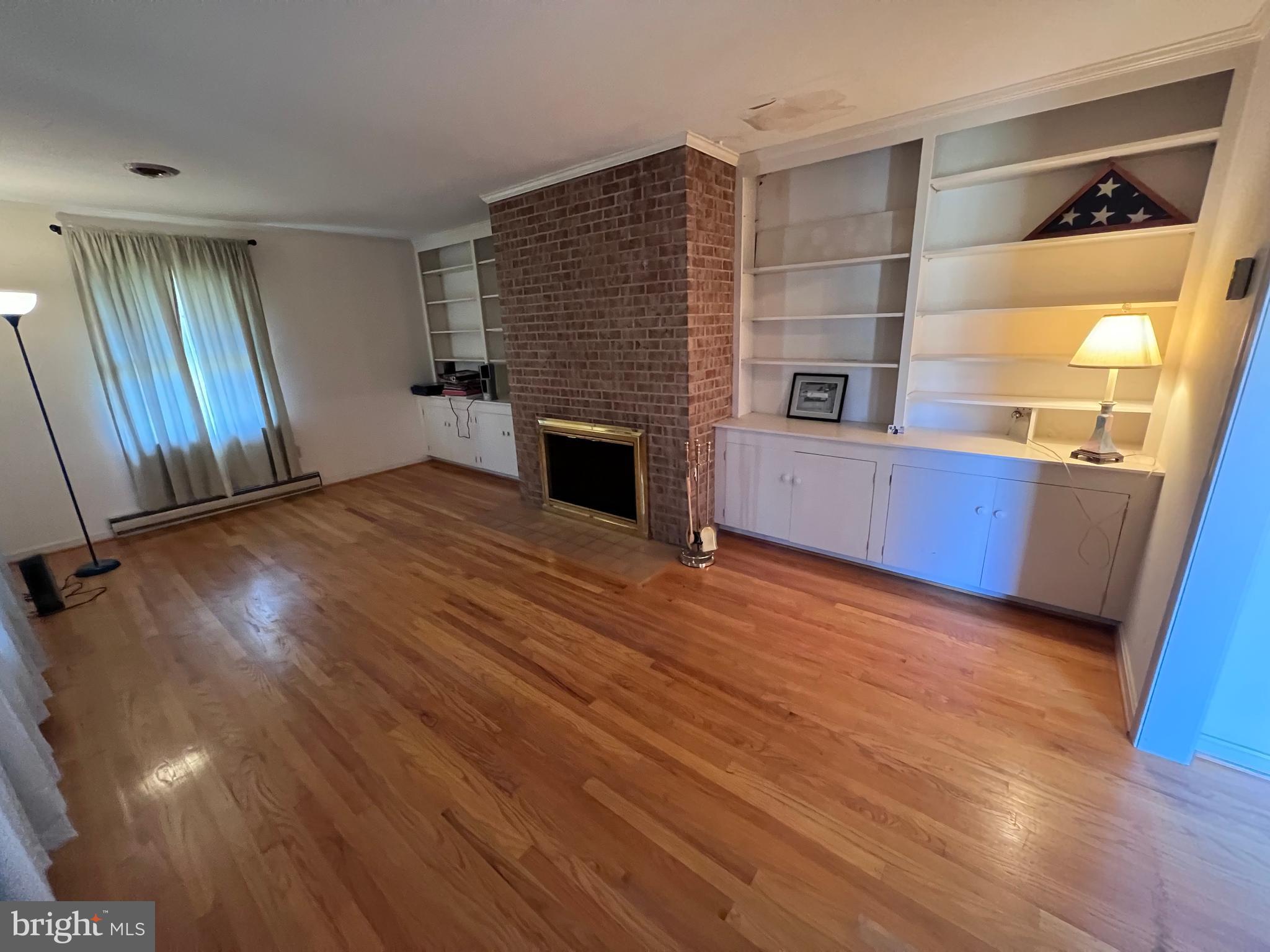 7119 Academy Road Warrenton, VA 20187 - Photo 13 of 21 a view of a kitchen with furniture and a fireplace