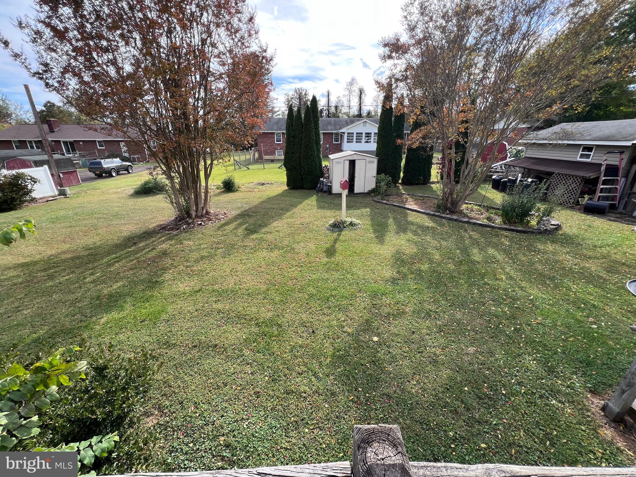 7119 Academy Road Warrenton, VA 20187 - Photo 21 of 21 a backyard of a house with fire pit and chairs