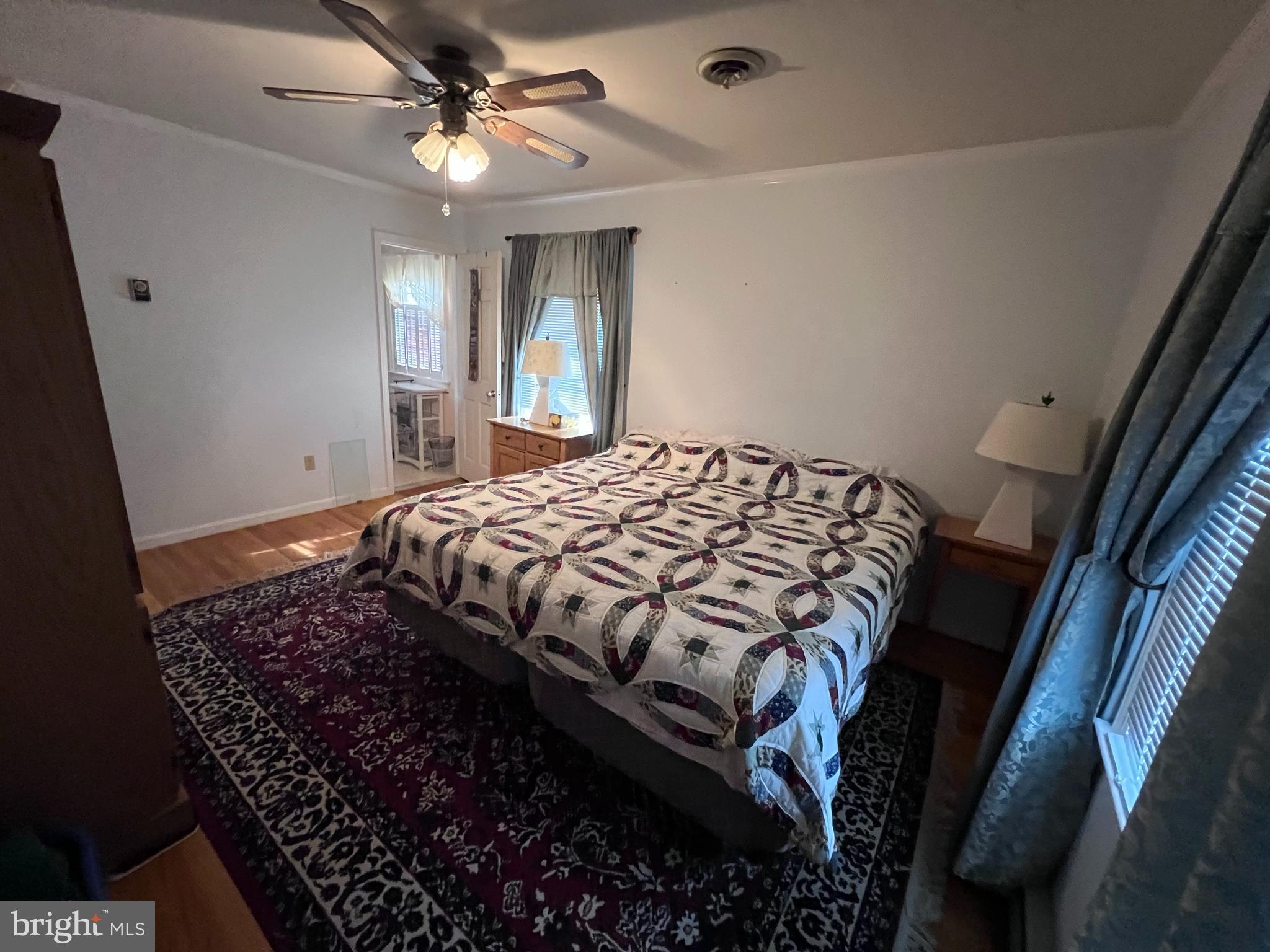 7119 Academy Road Warrenton, VA 20187 - Photo 10 of 21 a bedroom with a bed dresser and a window