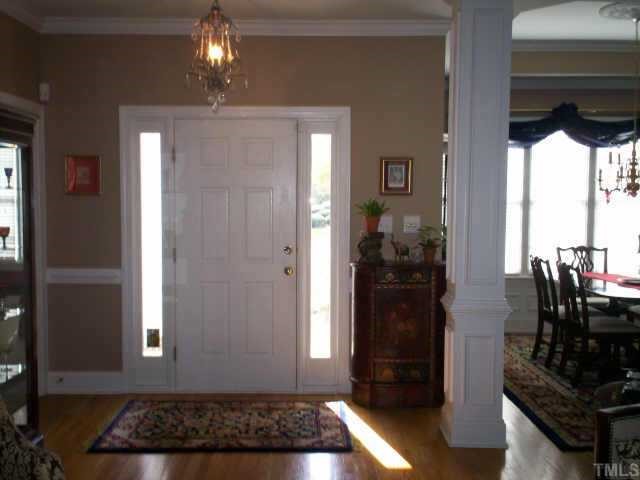 629 Sarah Lawrence Court Raleigh, NC 27609 - Photo 4 of 12 Large foyer with hardwood floors