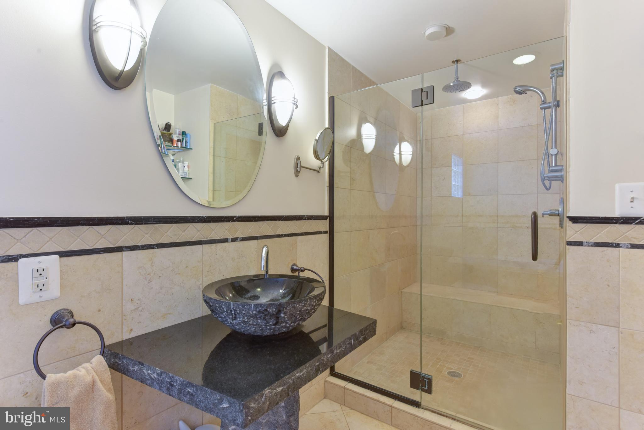 3201 Russell Road Alexandria, VA 22305 - Photo 22 of 60 a bathroom with a mirror sink and vanity