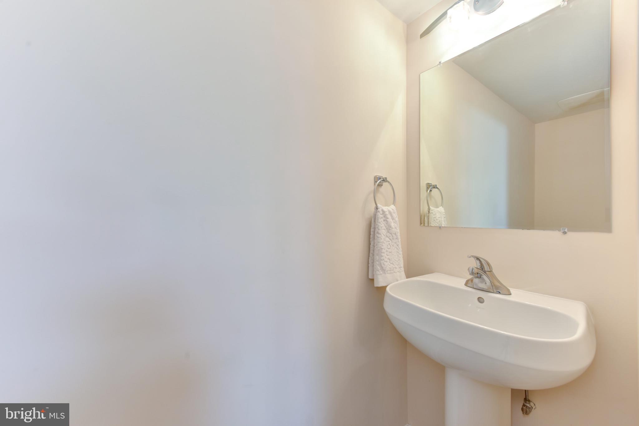 3201 Russell Road Alexandria, VA 22305 - Photo 44 of 60 a bathroom with a sink and a mirror