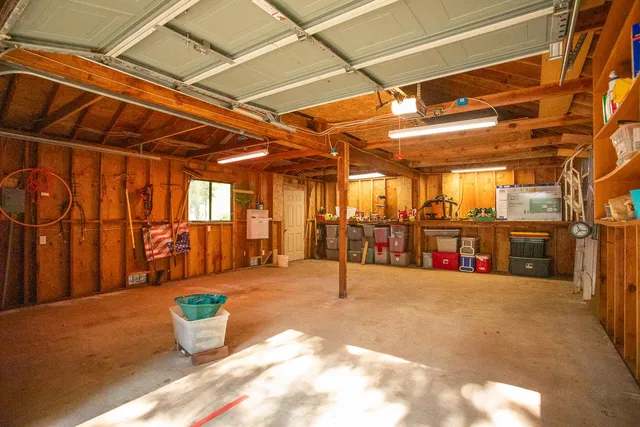 a view of a patio with a table and chairs