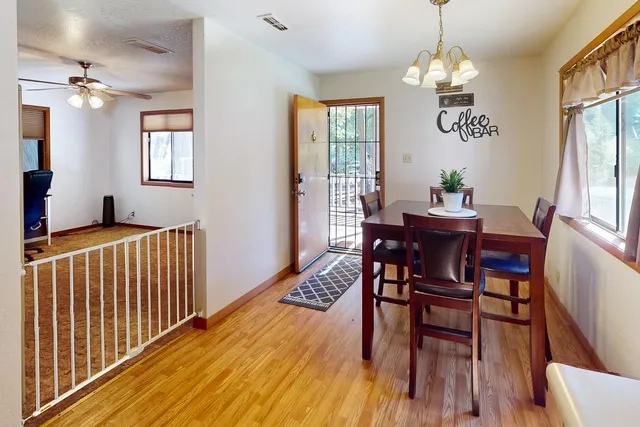 a view of a dining room with furniture window and wooden floor