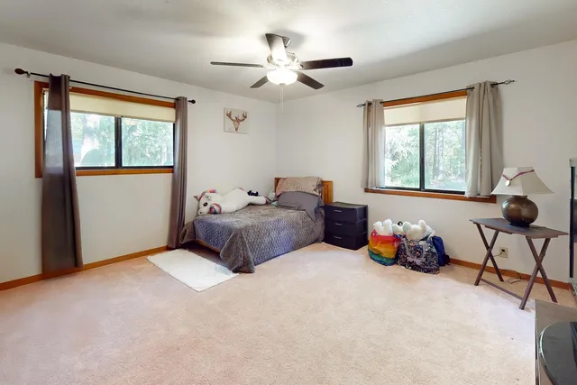 a bed room with furniture and a window
