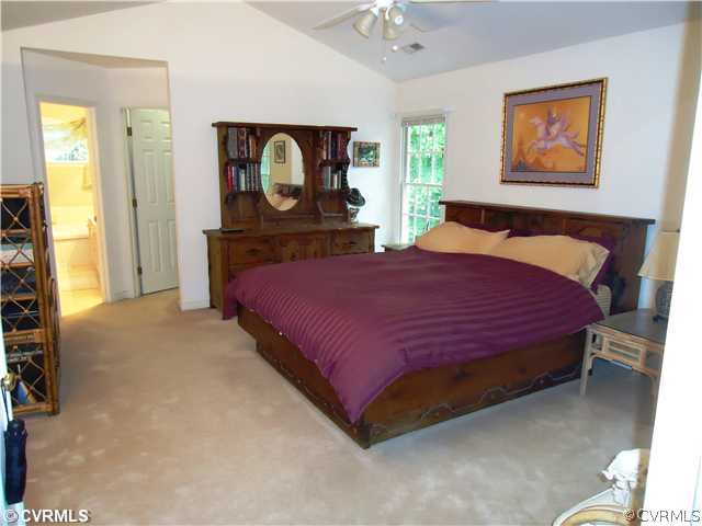 12600 Queensgate Road Midlothian, VA 23114 - Photo 6 of 7 a bedroom with a bed and a painting on the wall