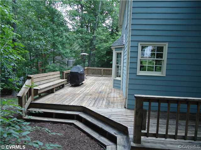 12600 Queensgate Road Midlothian, VA 23114 - Photo 7 of 7 a view of a wooden bench sitting in front of a house