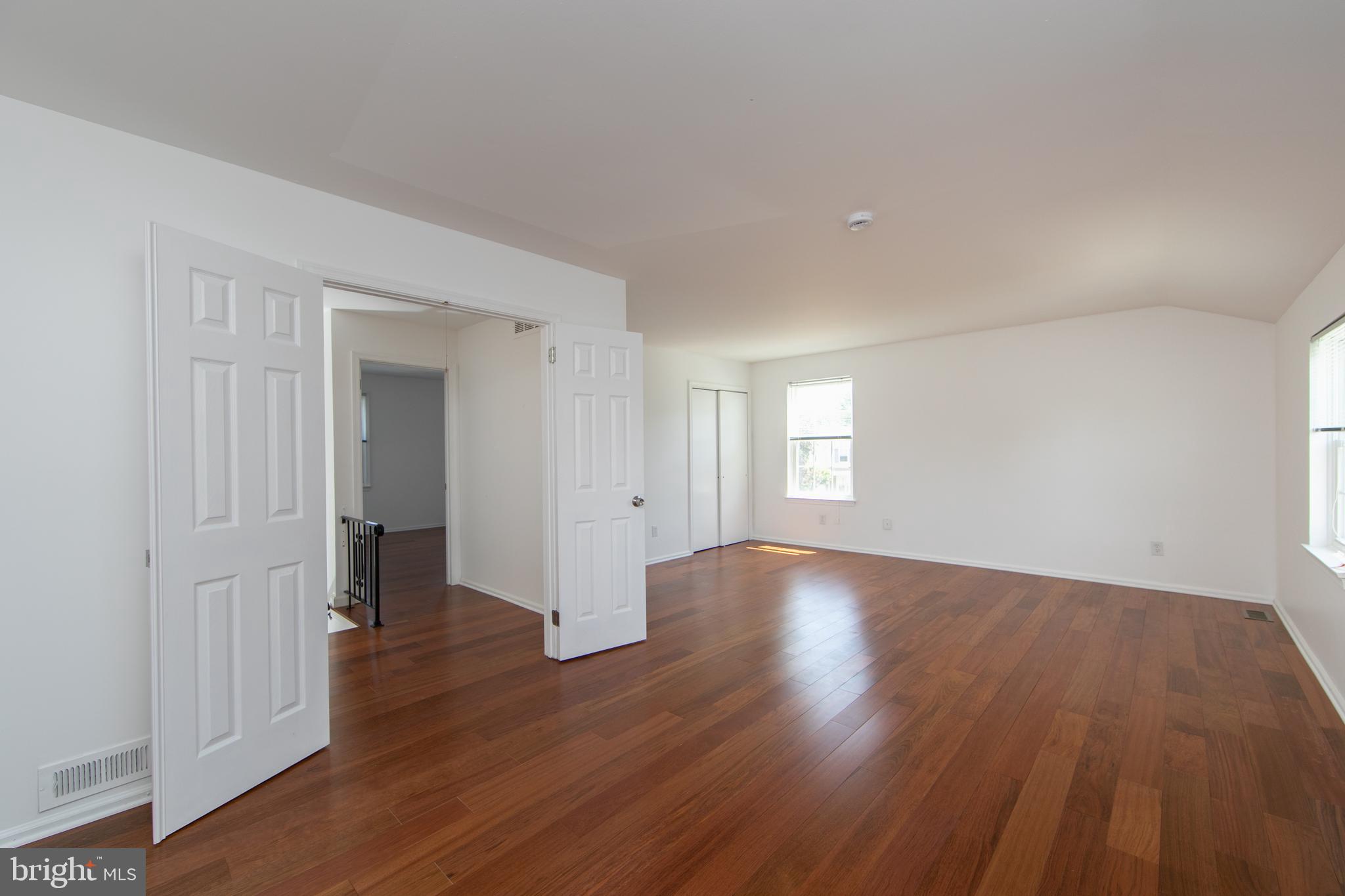 3007 Rampart Road Bensalem, PA 19020 - Photo 26 of 48 an empty room with wooden floor and windows