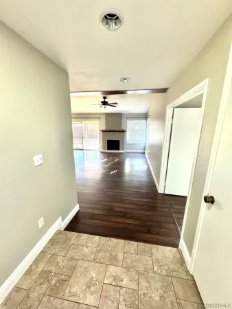 a view of a living room with a wooden floor