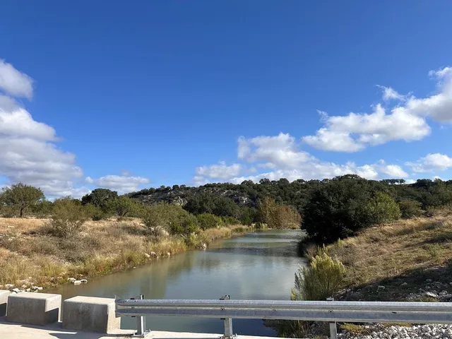 a view of a lake with houses in the background