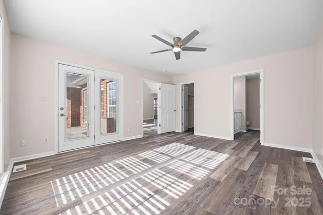 a spacious bathroom with a double vanity sink and a mirror