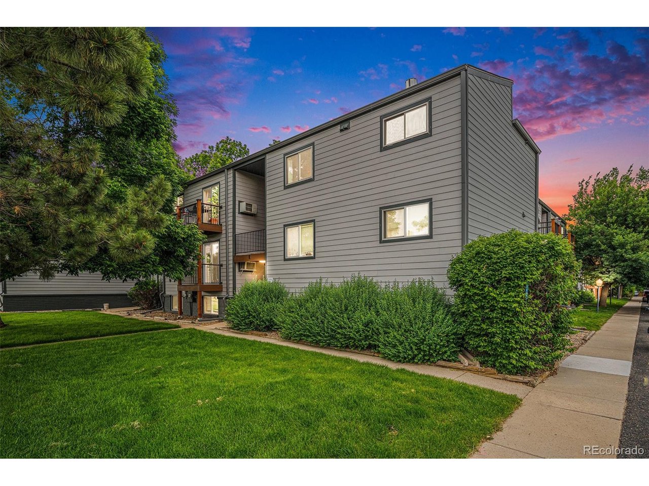 16259 West 10th Avenue, Unit K Golden, CO 80401 - Photo 16 of 24 a front view of a house with a yard