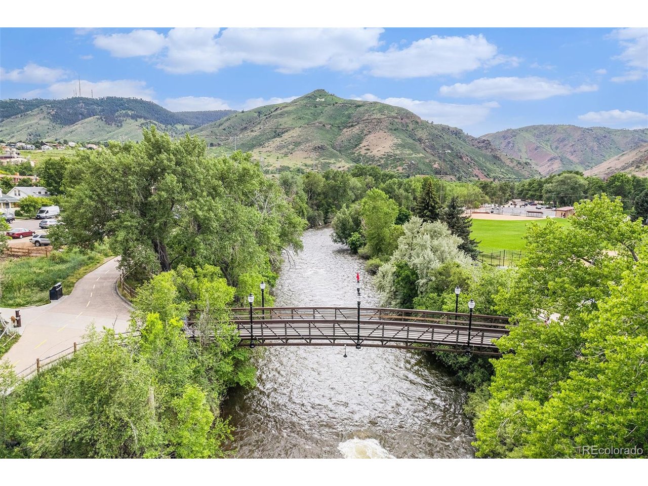 16259 West 10th Avenue, Unit K Golden, CO 80401 - Photo 20 of 24 a view of a houses with a yard and mountain