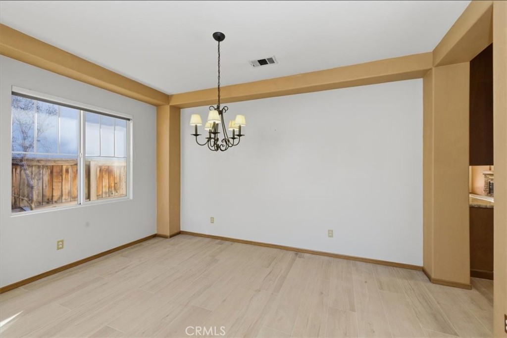 13747 Robinbrook Court Eastvale, CA 92880 - Photo 11 of 50 a view of an empty room with a window