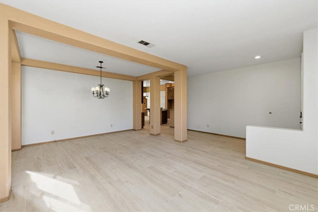 13747 Robinbrook Court Eastvale, CA 92880 - Photo 13 of 50 wooden floor in an empty room