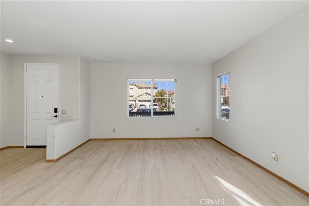 13747 Robinbrook Court Eastvale, CA 92880 - Photo 15 of 50 an empty room with windows