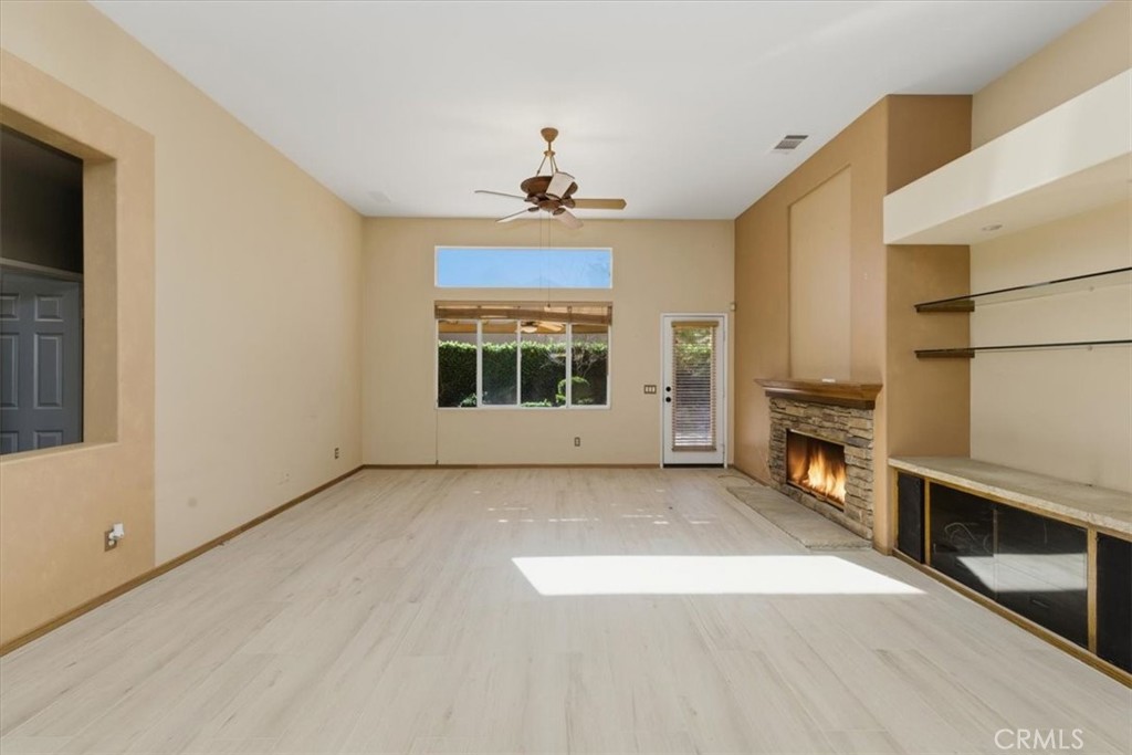 13747 Robinbrook Court Eastvale, CA 92880 - Photo 26 of 50 a view of a kitchen with a sink dishwasher oven window and wooden floor