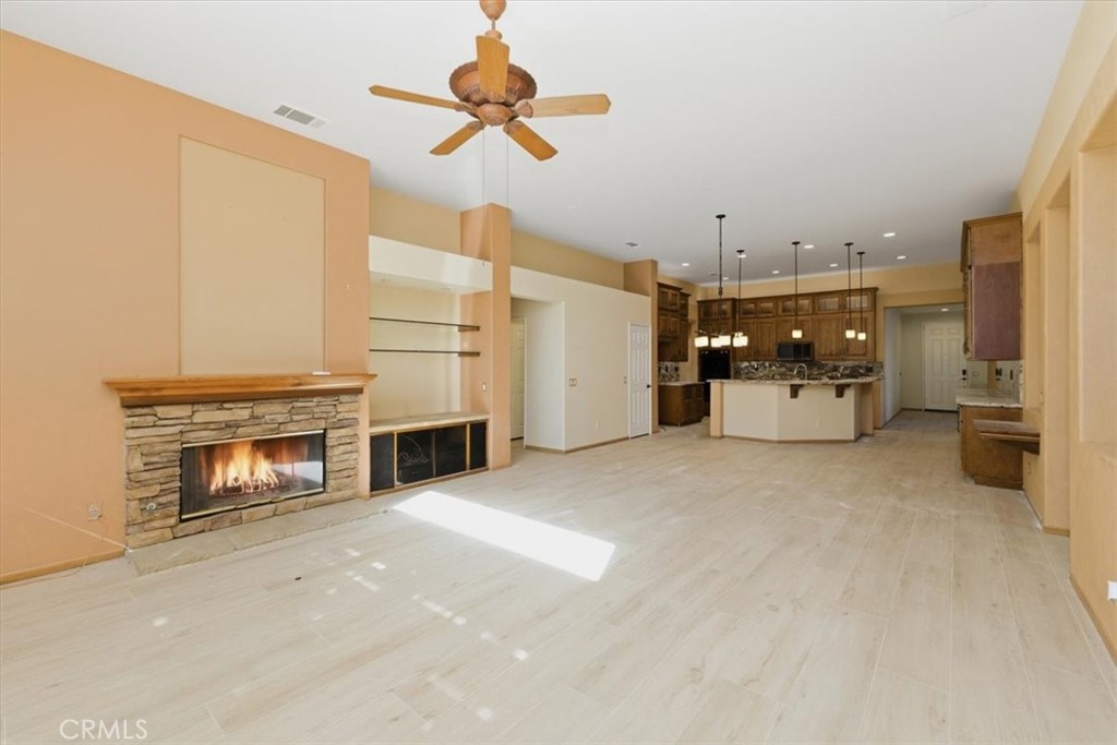 13747 Robinbrook Court Eastvale, CA 92880 - Photo 29 of 50 a view of a livingroom with a fireplace