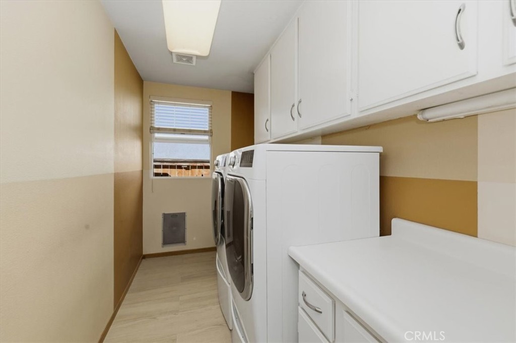 13747 Robinbrook Court Eastvale, CA 92880 - Photo 31 of 50 a utility room with dryer and washer