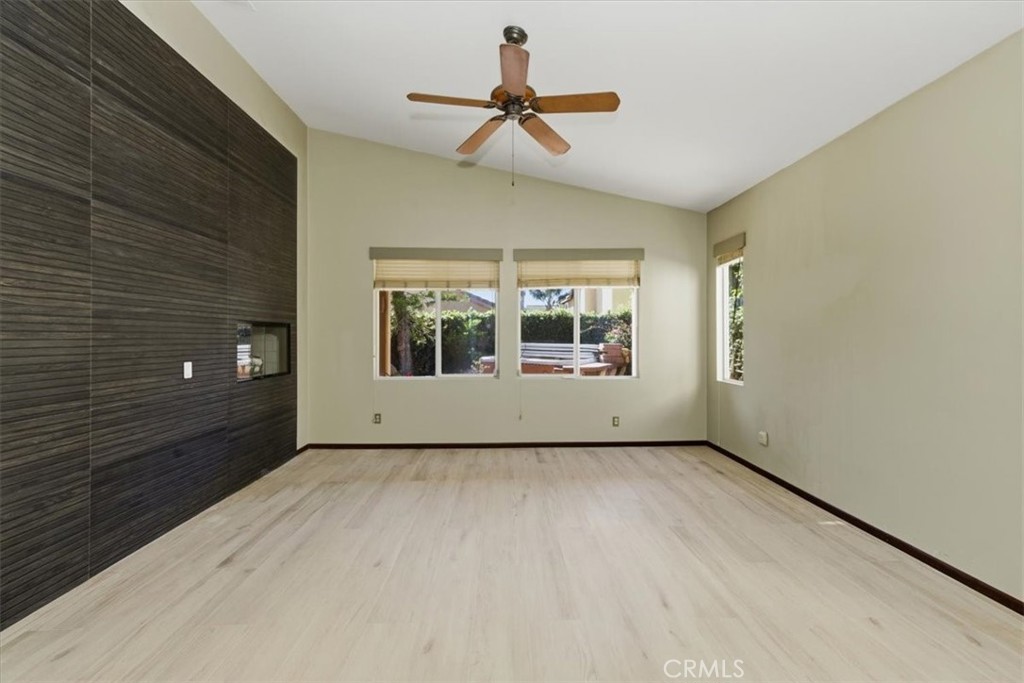 13747 Robinbrook Court Eastvale, CA 92880 - Photo 36 of 50 a view of a livingroom with a ceiling fan and window