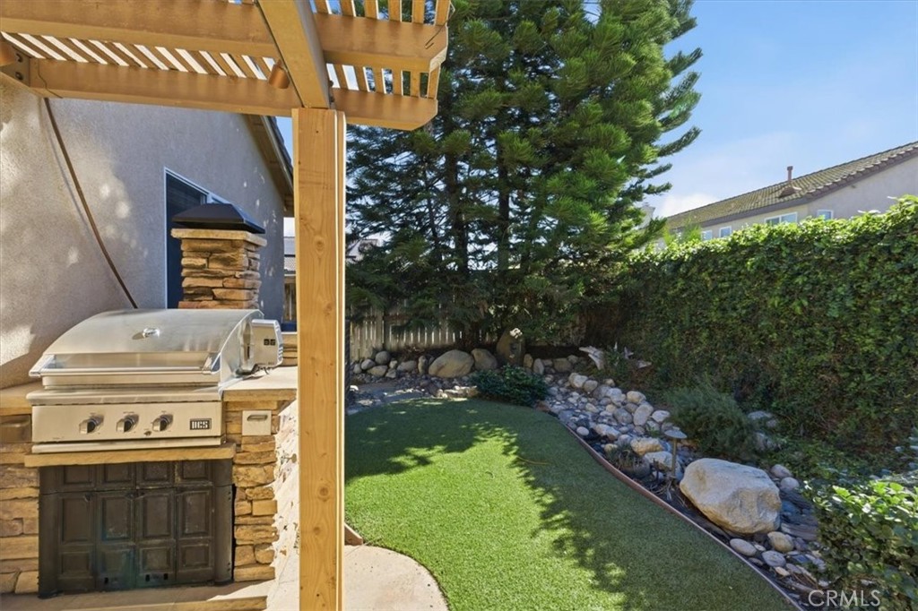 13747 Robinbrook Court Eastvale, CA 92880 - Photo 46 of 50 a view of bathroom with a sink and garden