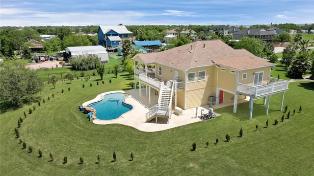 a aerial view of a house with table and chairs