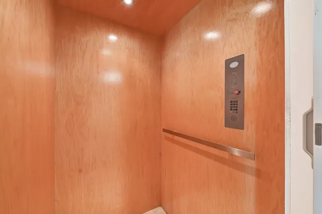 a kitchen with a stove sink and cabinets