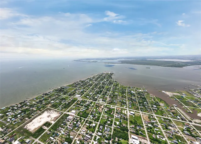 an aerial view of a house with outdoor space